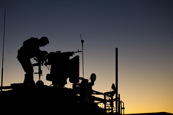 Senior Airman Drew Nicholson, of the 451st Expeditionary Support Squadron Security Forces Flight, inspects an M240 machine gun mounted to a common remote operating weapons station at Kandahar Airfield, Afghanistan, Jan. 21, 2016. Security forces members at Kandahar Airfield are responsible for the security of more than 150 aircraft and $2.2 billion of resources. (U.S. Air Force photo/Tech. Sgt. Robert Cloys)