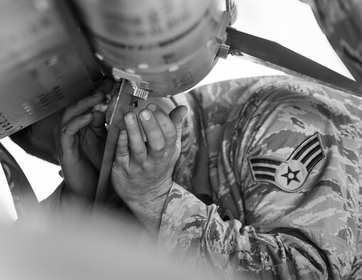 Senior Airman Christopher Mann, of the 96th Aircraft Maintenance Squadron Red, tightens down a fin on an AIM-120 AMRAAM while it’s loaded on an F-15 Eagle during the Loadcrew of the Year competition at Eglin Air Force Base, Fla., Jan. 29, 2016. Two F-15 loadcrews battled two F-16 Fighting Falcon loadcrews for the best time, and fewest mistakes, while loading three missiles onto their respective aircraft. The winners were revealed at the annual 96th Maintenance Group banquet in March. (U.S. Air Force photo/Samuel King Jr.)