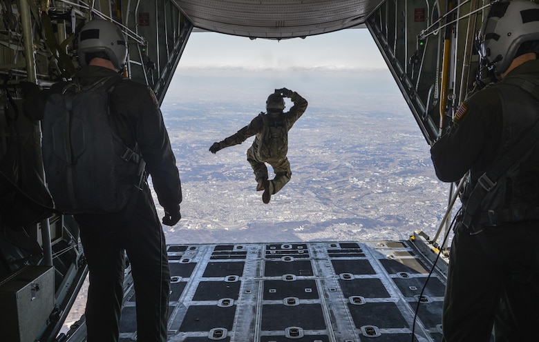 Tech. Sgt. Benjamin Jonas, the 374th Operations Support Squadron’s survival, evasion, resistance and escape operations NCO in charge, jumps out of a C-130 Hercules while flying over Yokota Air Base, Japan, March 2, 2016. During the high-altitude, low-opening airdrop, Jonas jumped from 10,000 feet and parachuted to the base. (U.S. Air Force photo/Senior Airman David Owsianka)