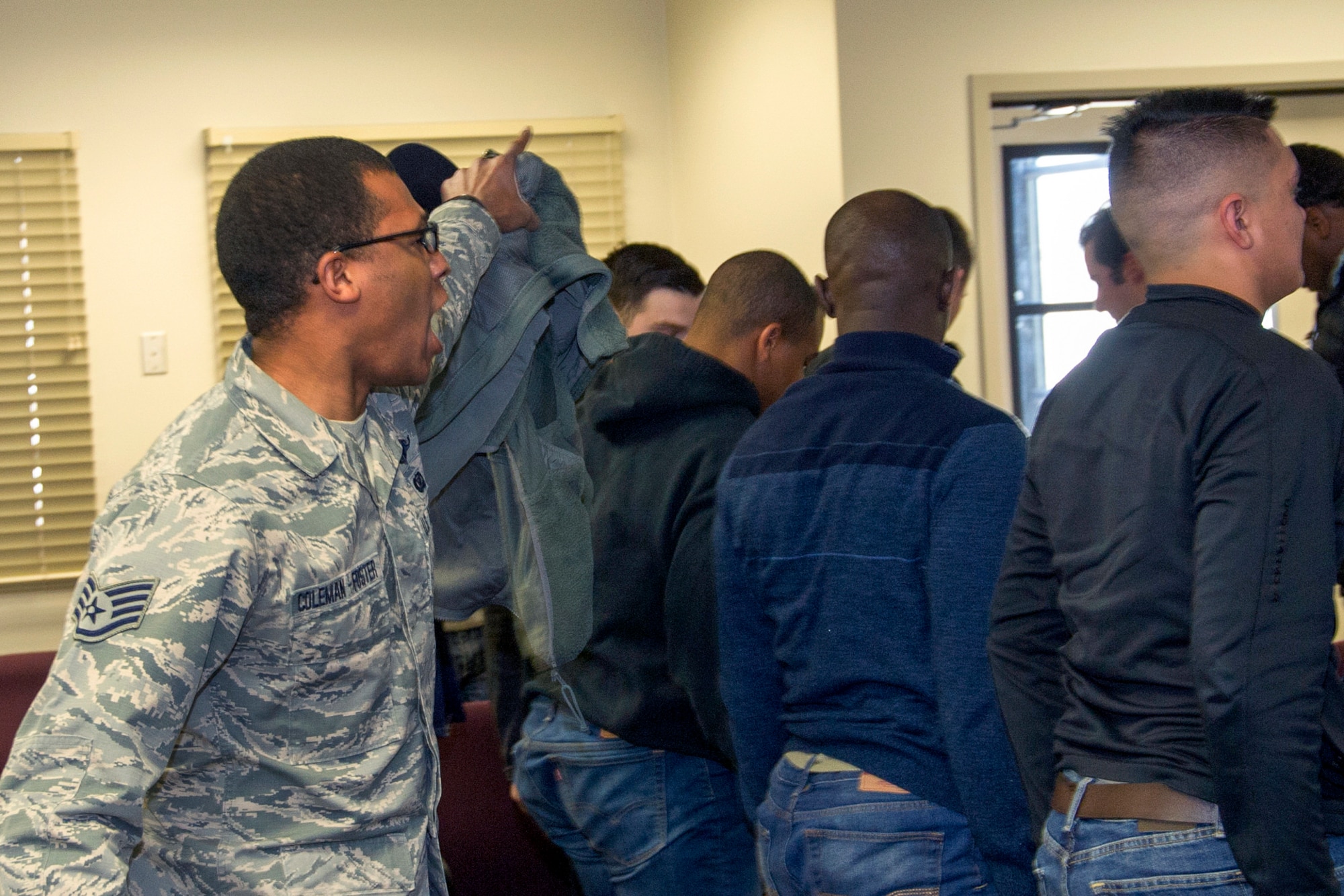SCHRIEVER AIR FORCE BASE, Colo. -- Former Military Training Instructor, Staff Sgt. Matthew Coleman-Foster, gives Delayed Enlistment Program trainees a look into what they can expect from Basic Military Training Saturday, Jan. 7th, 2017. Staff Sgt. Coleman-Foster assisted in teaching the DEP trainees important drill and ceremony techniques that they will utilize in Basic Military Training. (U.S. Air Force photo/Staff Sgt. Christopher Moore)