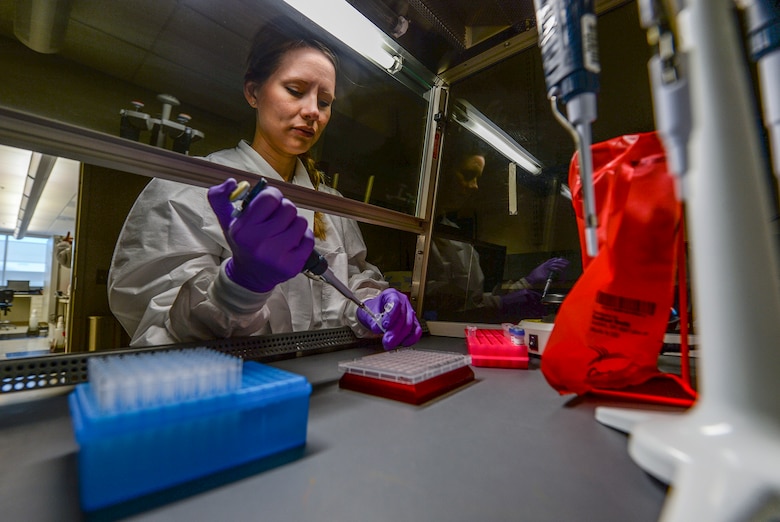 Marie Powell, general supervisor of molecular diagnostics, draws human biological samples before testing them for the Zika virus at the Epidemiology Lab at Wright-Patterson Air Force Base, Ohio, April 20, 2016. The Aedes mosquito can spread serious diseases such as dengue fever, yellow fever, the Zika virus and chikungunya. (U.S. Air Force photo/Master Sgt. Brian Ferguson)