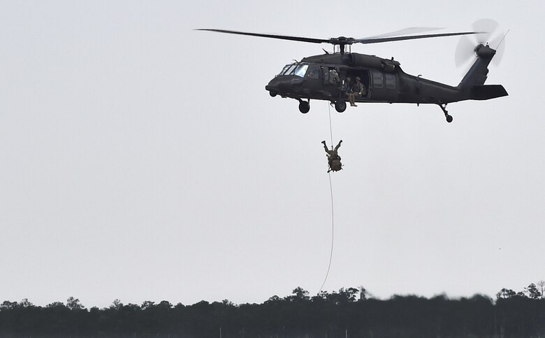 Soldiers fast rope from a UH-60 Black Hawk during Emerald Warrior 16 at Hurlburt Field, Fla., May 3, 2016. Emerald Warrior 16 is a U.S. Special Operation Command sponsored mission rehearsal exercise in which joint special operations forces train to respond to real and emerging worldwide threats. (U.S. Air Force photo/Senior Airman Logan Carlson)