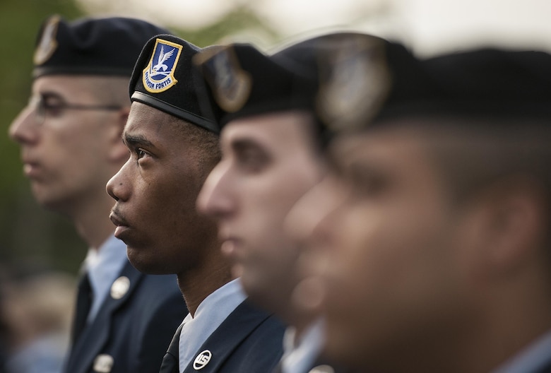 A row of 96th Security Forces Squadron Airmen stand at parade rest during the Peace Officers’ Memorial Ceremony May 16, 2016, in Fort Walton Beach, Fla.  The ceremony honored fallen police officers from the previous year by reading their names aloud. Security forces Airmen from Eglin Air Force Base, Fla., and Hurlburt Field, Fla., attended and participated in the event. (U.S. Air Force photo/Samuel King Jr.)
