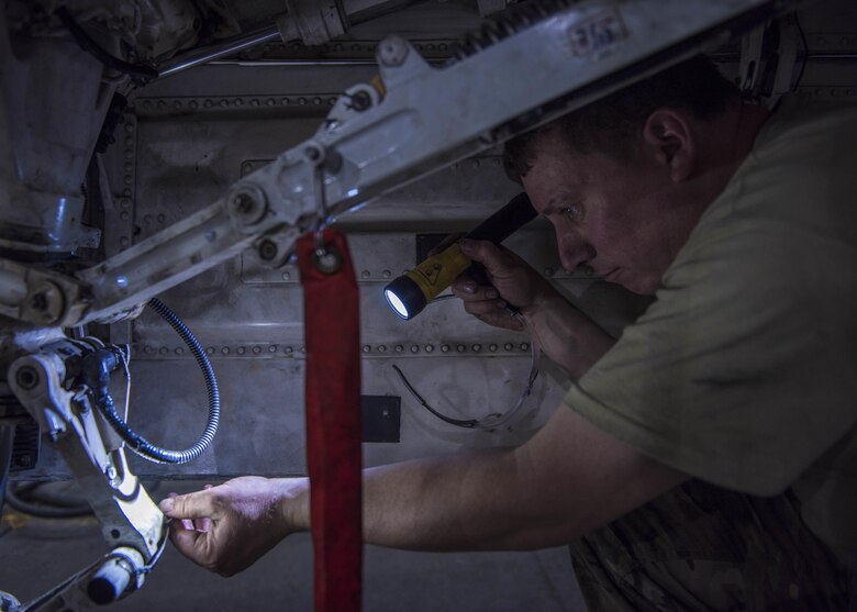 Tech. Sgt. Christopher Melrose, a 455th Expeditionary Aircraft Maintenance Squadron phase technician, inspects the interior of an F-16C Fighting Falcon during routine phase maintenance at Bagram Airfield, Afghanistan, May 18, 2016. The aircraft went through phase maintenance where members of the 455th EAMXS phase flight closely inspected the aircraft for cracks and other types of damage, verifying that the 30-plus year old aircraft was safe to fly. (U.S. Air Force photo/Senior Airman Justyn M. Freeman)