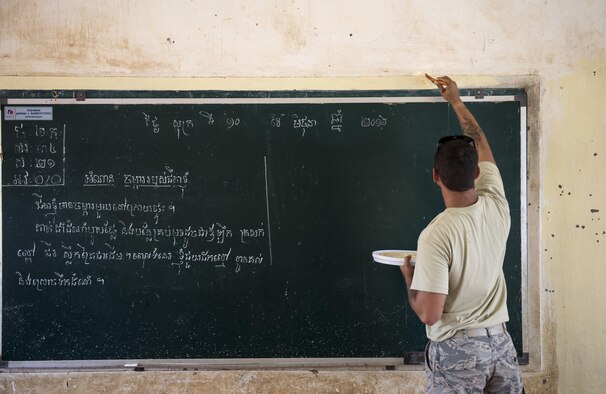 Staff Sgt. Shane Harding, a 647th Civil Engineer Squadron structures craftsman, paints a classroom during Pacific Angel 16-2, June 12, 2016, at Wat Steung Primary School in Kampot, Cambodia. The U.S. developed Pacific Angel to enhance relations and interoperability with other countries in the Indo-Asia-Pacific region. Additionally, the mission gives the U.S. an opportunity to support the efforts of other governments in the region to provide medical, dental, optometry, and engineering assistance, and subject matter expert exchanges to host nation citizens. (U.S. Air Force photo/Senior Airman Omari Bernard)
