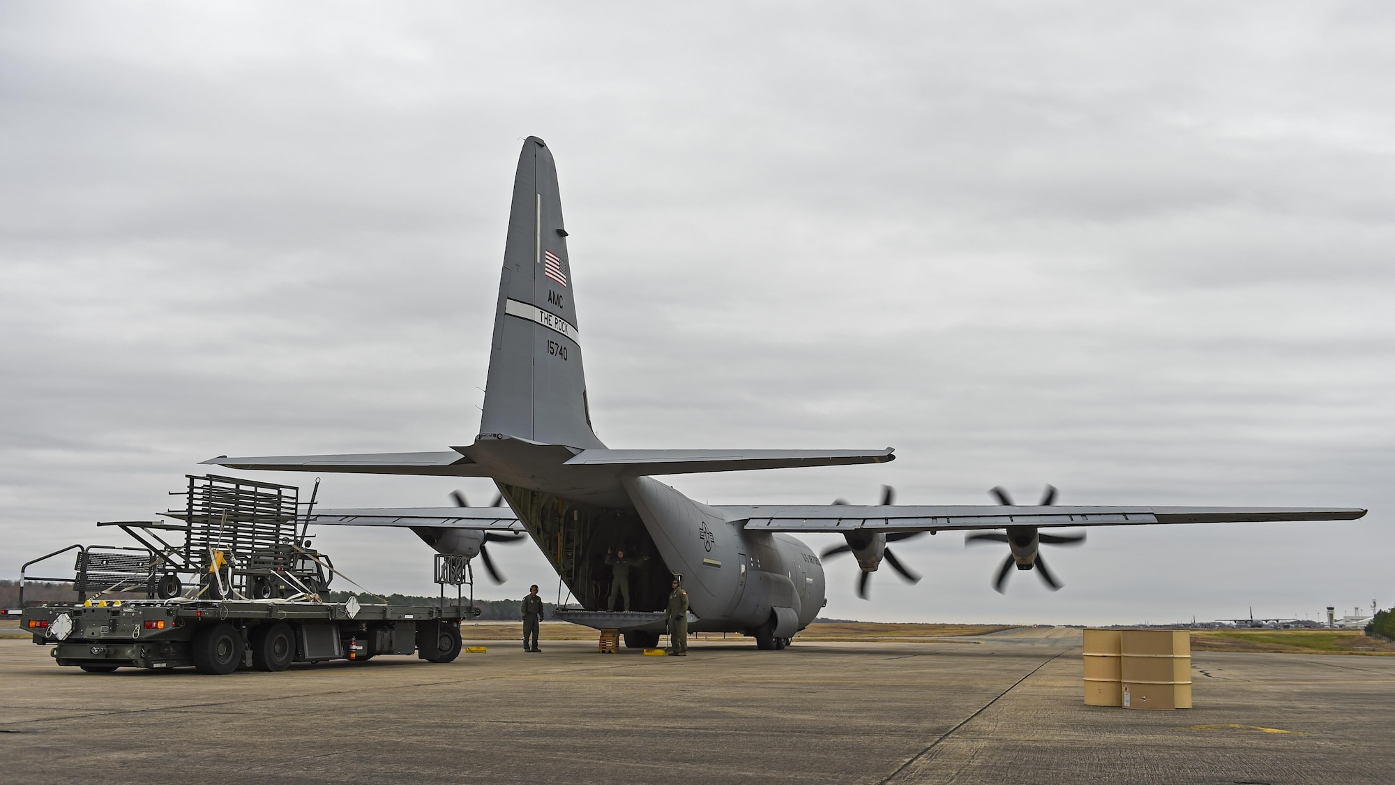 U.S. Air Force C-130J loadmasters from the 61st Airlift Squadron prepare to perform a Combat Offload Method B technique Dec 7, 2016, at Little Rock Air Force Base, Ark. The technique is often used by C-130 aircrews in austere locations to quickly offload supplies. (U.S Air Force photo by Senior Airman Harry Brexel) 