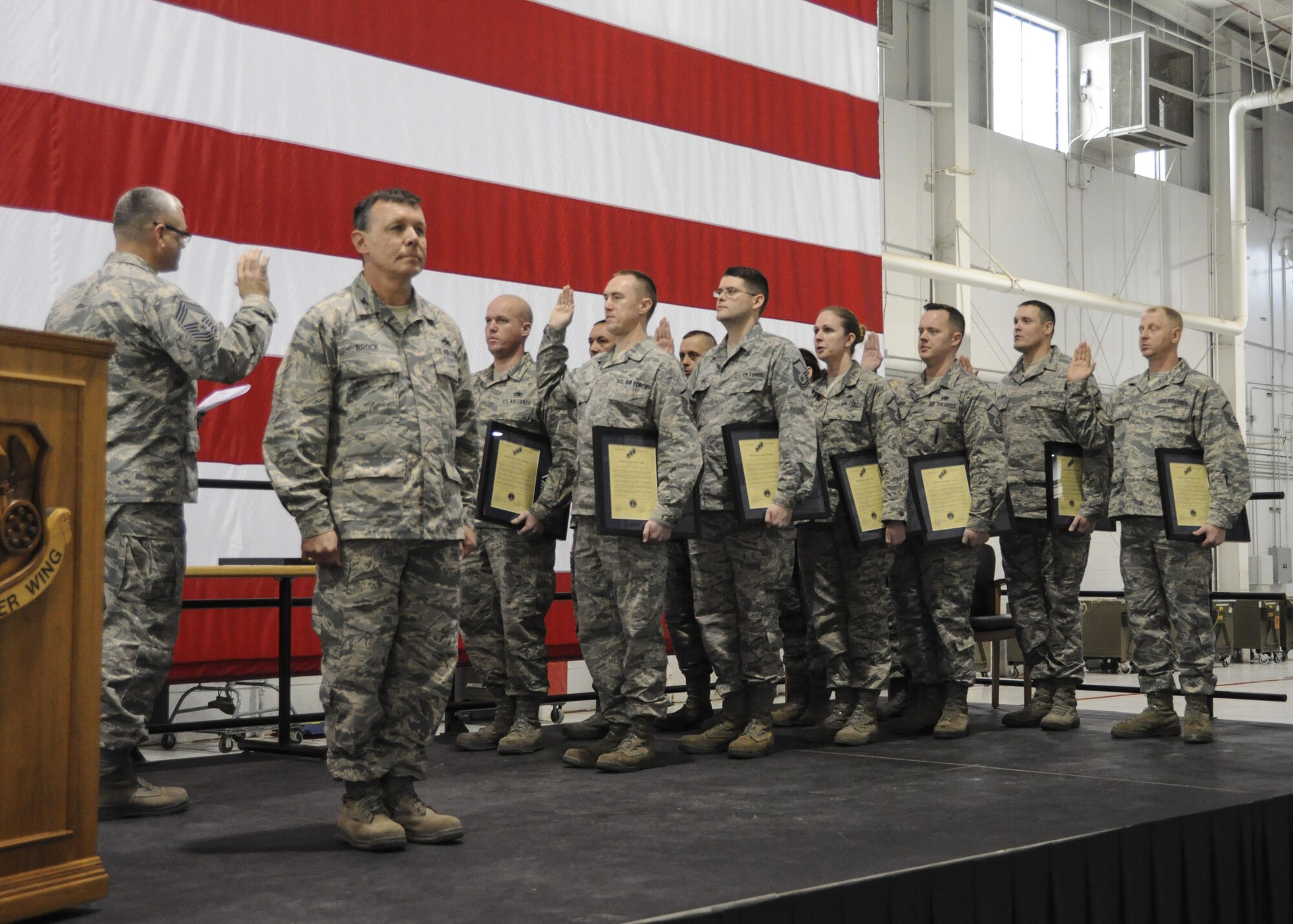 Inductees with the 442d Maintenance Group recite the senior non-commissioned officer creed during the NCO and Senior NCO induction ceremony at Whiteman Air Force Base, Missouri, Jan. 7, 2017. The ceremony is a tradition to congratulate Airmen in their new position while reminding SNCOs how far they've come and inspiring NCOs to continue developing their leadership abilities. (U.S. Air Force photo/Senior Airman Missy Sterling)