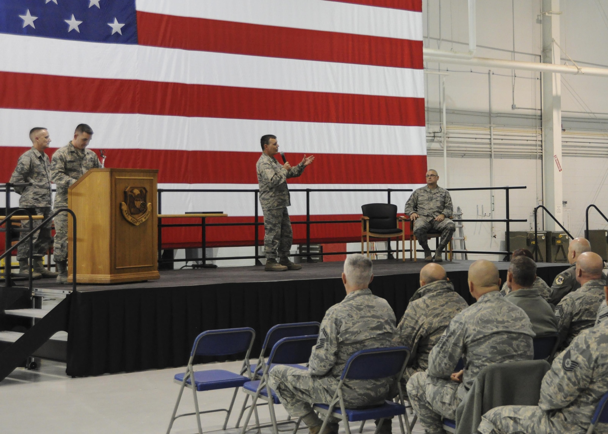 U.S. Air Force Col. James Brock, 442d Maintenance Group commander, addresses the men and women of the 442d Fighter Wing during the non-commissioned officer and senior NCO induction ceremony at Whiteman Air Force Base, Missouri, Jan. 7, 2017. Brock congratulated the incoming NCOs and SNCOs on their promotions and thanked them for their dedication to the unit. (U.S. Air Force photo/Senior Airman Missy Sterling)