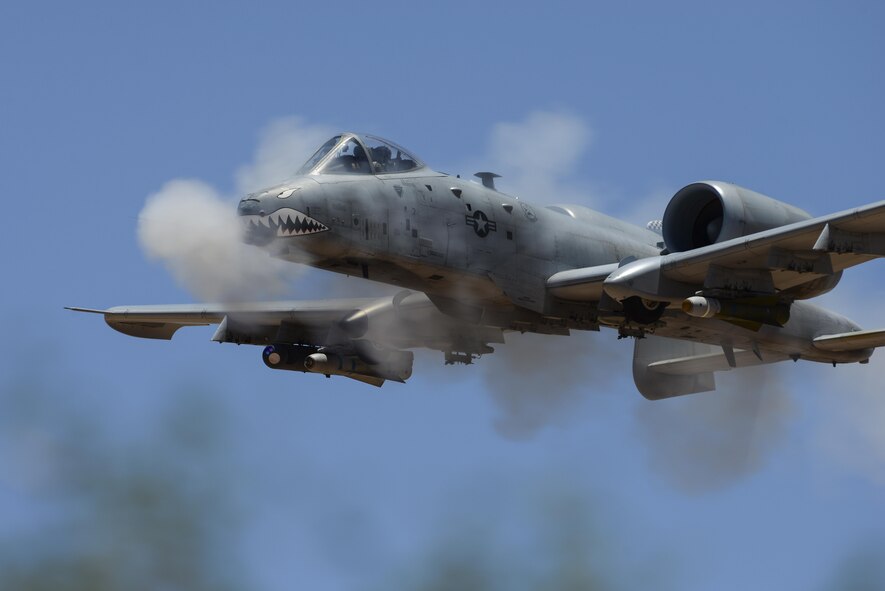 An A-10C Thunderbolt II, assigned to the 75th Fighter Squadron, performs a low-angle strafe during the Hawgsmoke competition at Barry M. Goldwater Range, Ariz., June 2, 2016. The two-day competition included team and individual scoring of strafing, high-altitude dive-bombing, Maverick missile precision and team tactics. (U.S. Air Force photo/Senior Airman Chris Drzazgowski)