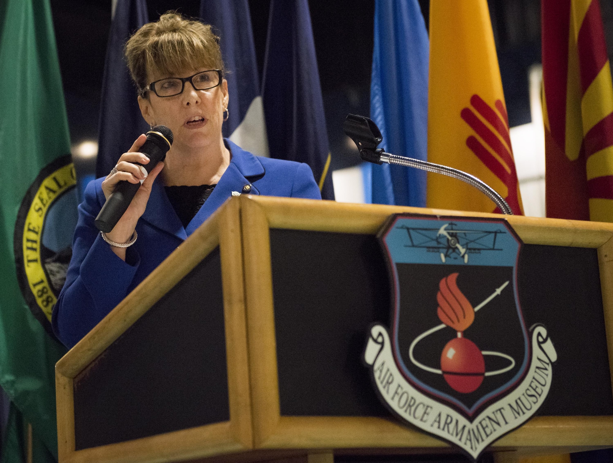 Lee McGehee, 96th Test Wing vice director, speaks to the audience during her retirement ceremony Jan. 5 at Eglin Air Force Base, Fla.  McGehee served the Air Force for more than 30 years.  (U.S. Air Force photo/Ilka Cole)