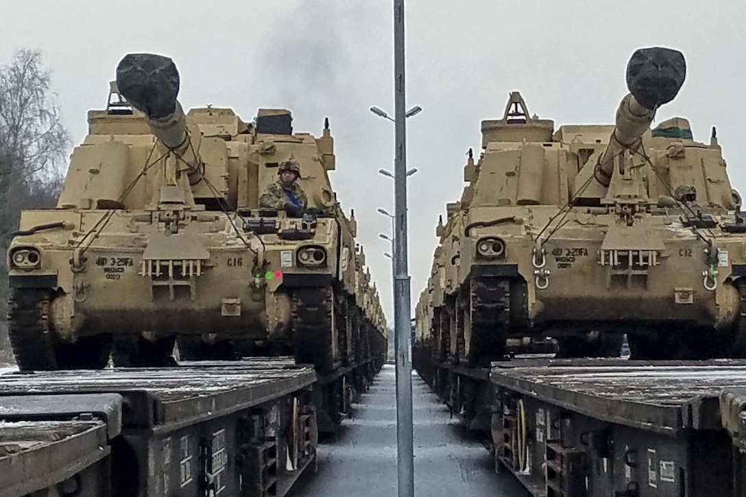 M106 Paladin self-propelled howitzers shipped from Germany sit on flatbed vehicles after crews offloaded them in Drawsko Pomorskie, Poland, Jan. 9, 2017. Soldiers will use the howitzers, assigned to to the 4th Infantry Division's 3rd Battalion, 29th Field Artillery Regiment, 3rd Armored Brigade, to conduct training in Eastern Europe as part of Operation Atlantic Resolve. Army photo by Staff Sgt. Corinna Baltos
