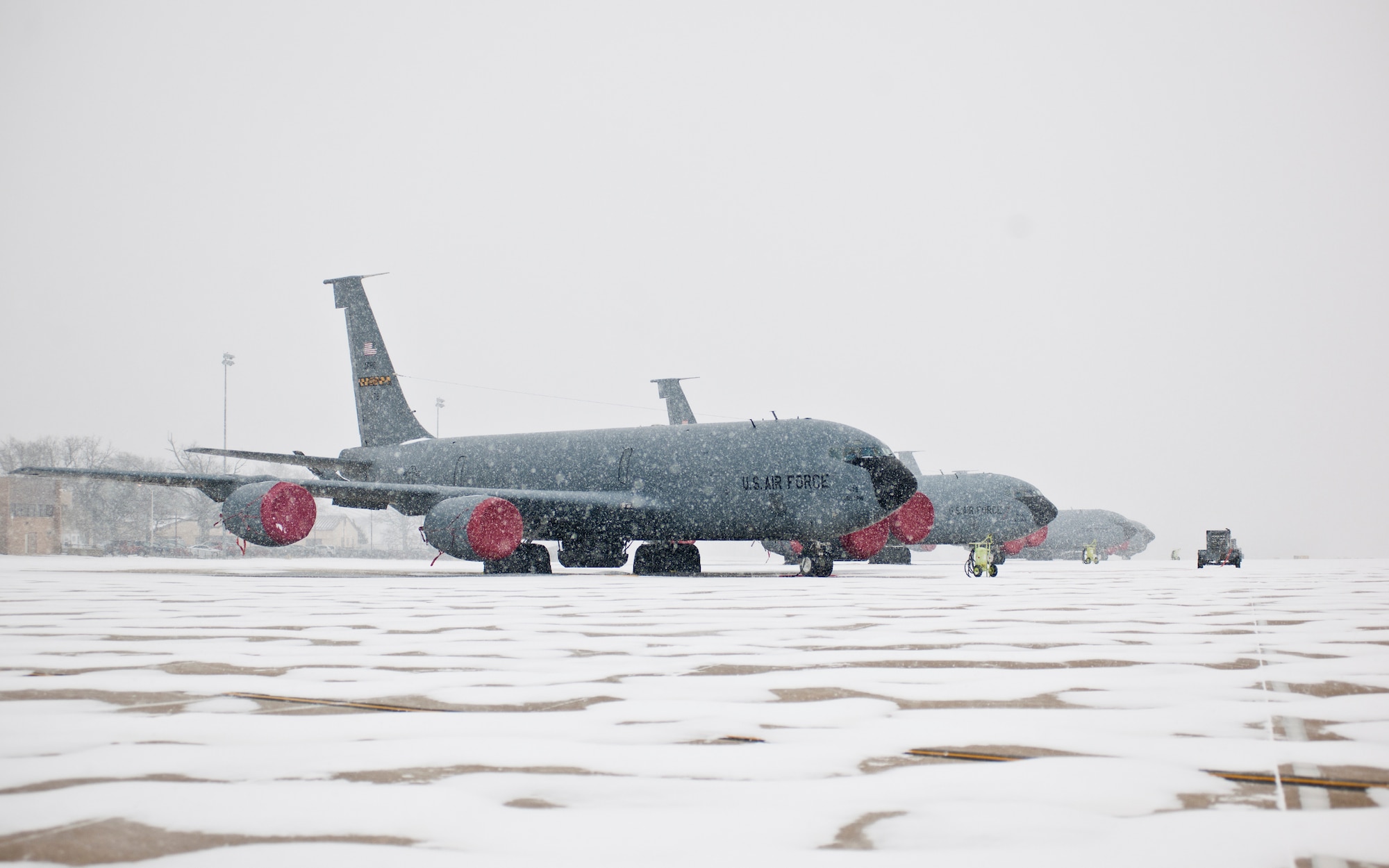 KC-135R Stratotankers with the 459th Air Refueling Wing rest on the Joint Base Andrews, Maryland, flight line during the region's first winter storm of the season Jan. 8, 2017. Up to two inches fell in parts of the National Capital Region during the 459th's drill weekend. (U.S. Air Force photo/Tech. Sgt. Kat Justen)