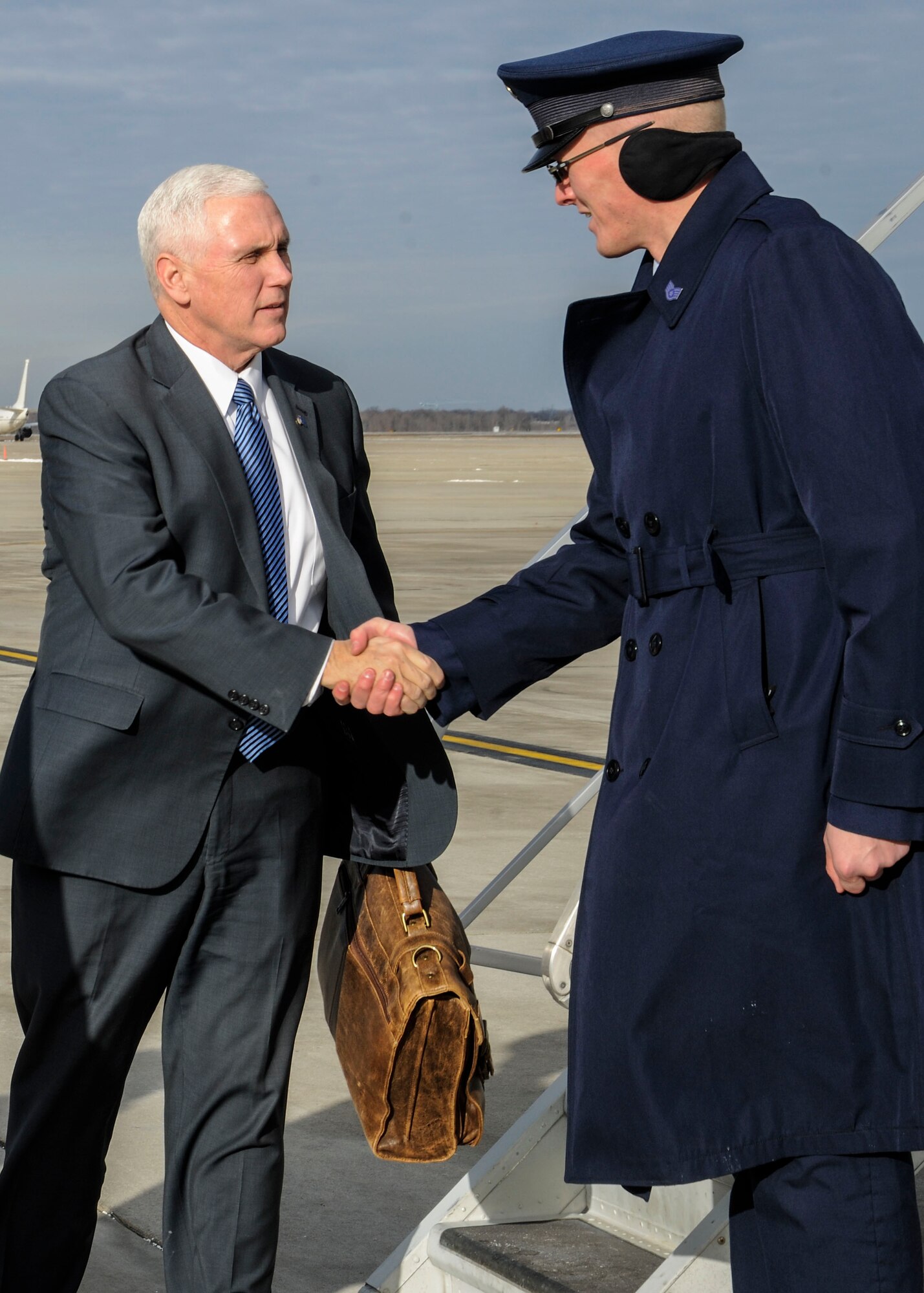 Vice President-elect Mike Pence greets Staff Sgt. Steven Howard, 89th Aerial Port Squadron special air missions supervisor, at Joint Base Andrews, Md., Jan. 9, 2017. Pence was in the area in preparation to take office on Jan. 20. (U.S. Air Force photo by Staff Sgt. Stephanie Morris)