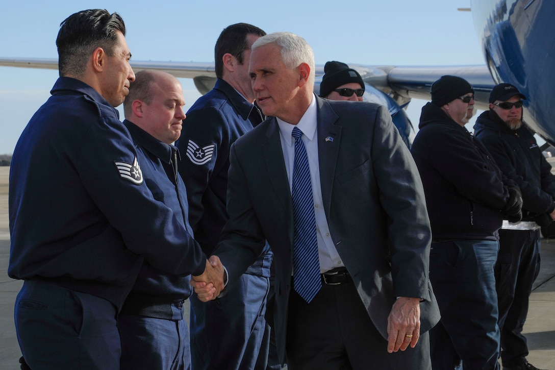 Vice President-elect Mike Pence greets Staff Sgt. Steven Howard, 89th Aerial Port Squadron special air missions supervisor, at Joint Base Andrews, Md., Jan. 9, 2017. Pence was in the area in preparation to take office on Jan. 20. (U.S. Air Force photo by Staff Sgt. Stephanie Morris)