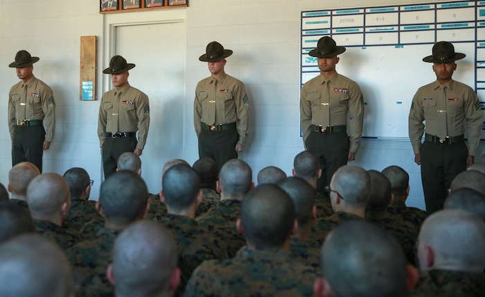 Drill instructors of Mike Company, 3rd Recruit Training Battalion, are introduced to their new recruits during pick up at Marine Corps Recruit Depot San Diego, Jan. 6. After spending the first week conducting in-processing, recruits marched to their new squad bay where their drill instructors introduced themselves, recited the Drill Instructor Creed and began carrying out the mission of transforming civilians into United States Marines. Annually, more than 17,000 males recruited from the Western Recruiting Region are trained at MCRD San Diego. Mike Company is scheduled to graduate March 31.