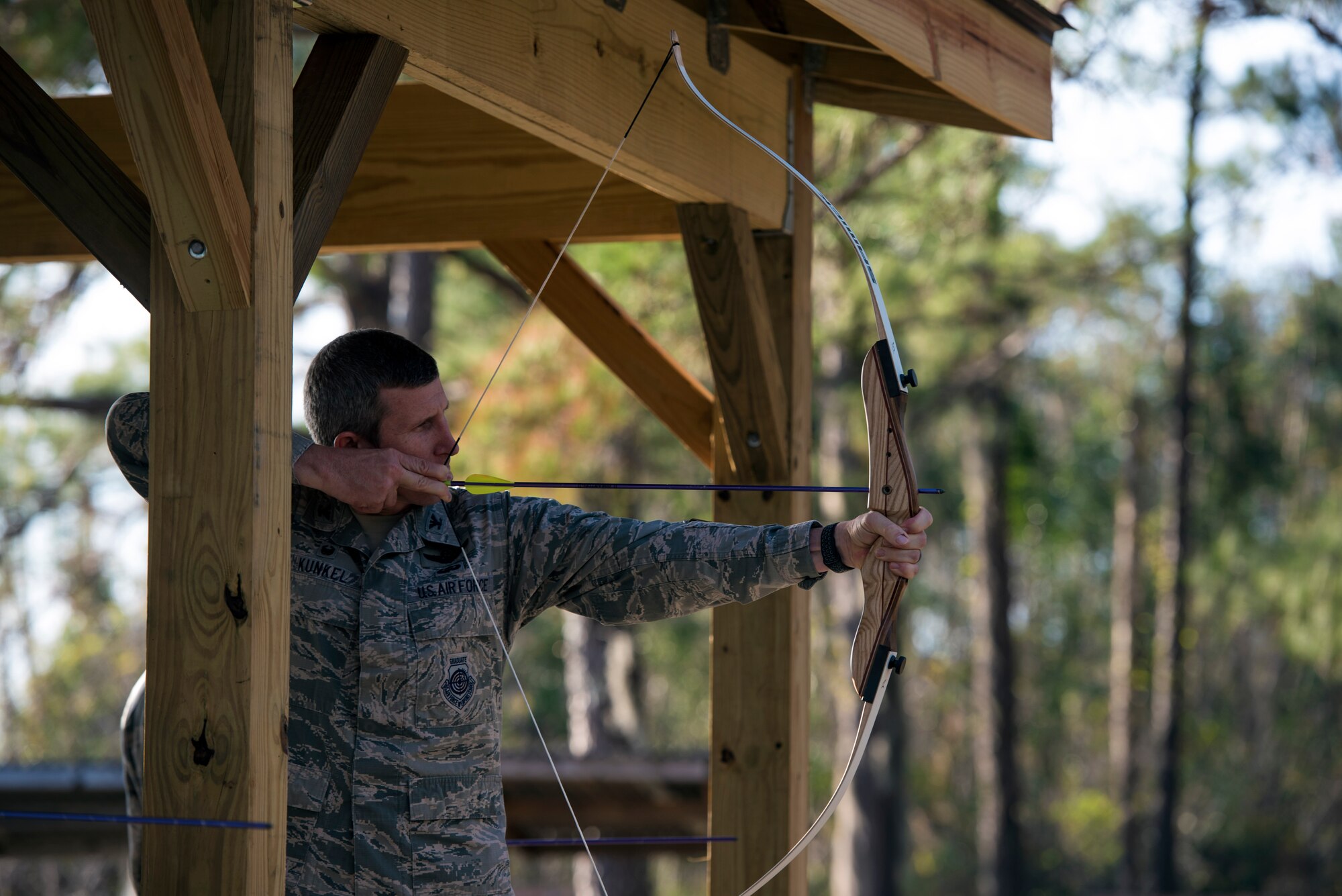 Col. Thomas Kunkel, 23d Wing commander, aims a bow and at a target in the newly renovated archery range, Jan. 5, 2017, at Moody Air Force Base, Ga. Moody leadership visited the range when it was reopened after being inactive for six months. It now includes a new elevated shooting pavilion, targets and stations. (U.S. Air Force photo by Airman 1st Class Greg Nash) 