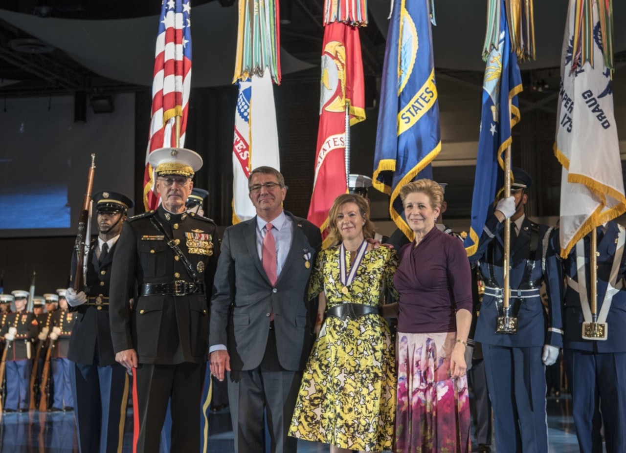 Defense Secretary Ash Carter and his wife, Stephanie, pose with Marine Corps Gen. Joe Dunford, chairman of the Joint Chiefs of Staff, and his wife Ellyn, during a farewell ceremony for Carter on behalf of the armed forces at Joint Base Myer-Henderson Hall, Va., Jan. 9, 2017. DoD photo by Air Force Tech. Sgt. Brigitte N. Brantley