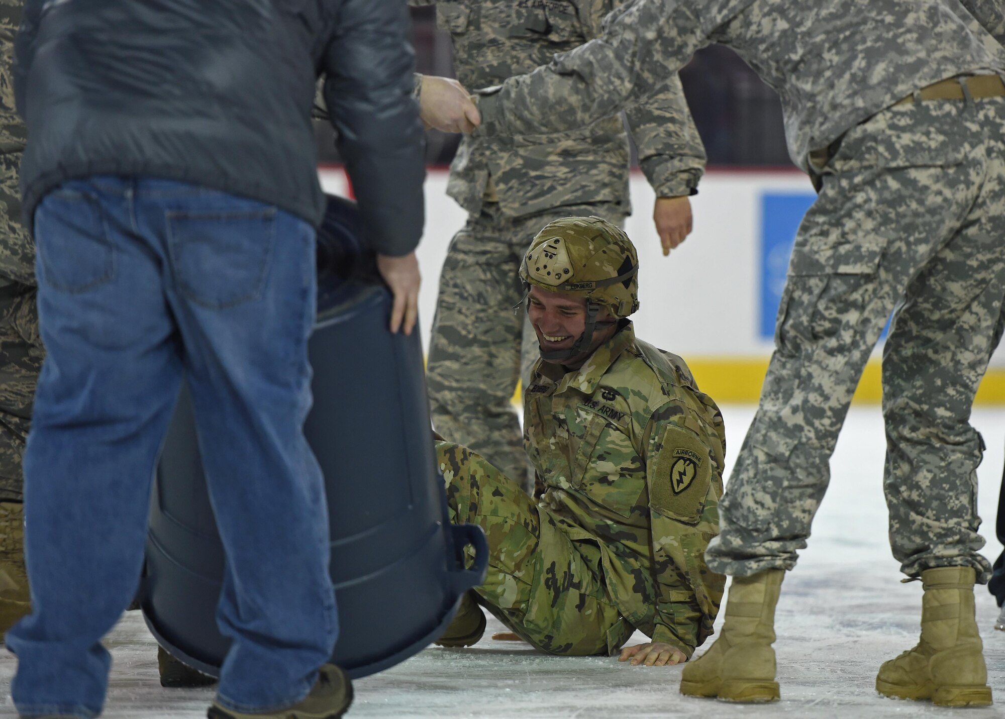 Joint Base Elmendorf-Richardson Soldiers and Airmen attempt to topple each other during the first-period break at the Army vs. Air Force Hockey game at the Sullivan Arena in Anchorage, Alaska, Jan. 7, 2017. Since the Army team won the match, both teams are now evenly split for event wins. 