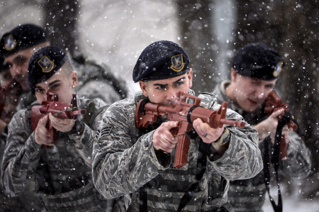 Airmen conduct room clearance training at Francis S. Gabreski Air National Guard Base in Westhampton Beach, N.Y., Jan. 7, 2017. The airmen are assigned to the 106th Rescue Wing's Security Forces Squadron. The training enables security forces to learn how to properly and safely clear and secure a room in a combat environment. Air National Guard photo by Staff Sgt. Christopher S. Muncy



