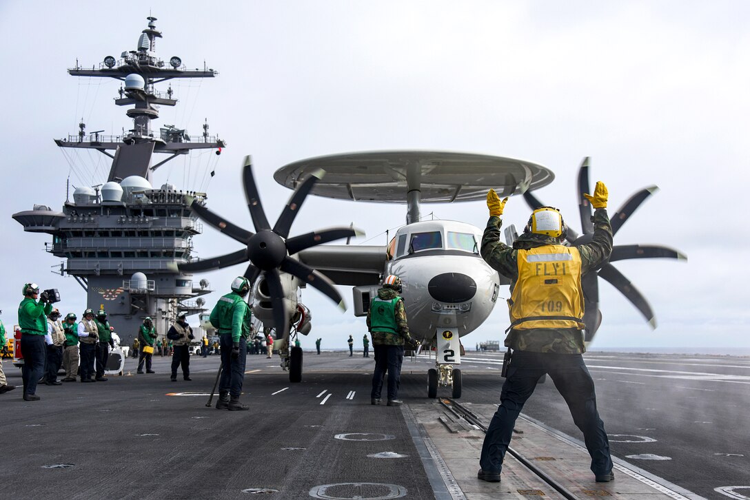 Sailors prepare to launch an E-2C Hawkeye from the flight deck of the aircraft carrier USS Carl Vinson in the Pacific Ocean, Jan. 5, 2017. Navy photo by Petty Officer 2nd Class Sean M. Castellano