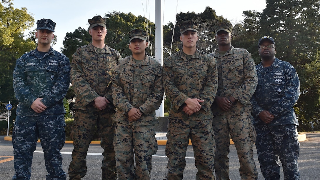 Four U.S. Marines and two Sailors instinctively responded alongside local residents when a vehicle with five passengers fell from the fifth story of a parking garage in Yokosuka, Dec. 31, 2016. Once the Marines arrived on scene, the group collectively flipped the car in order to remove the passengers prior to Japanese Emergency Medical Services arriving. The Marines are assigned to 3rd Battalion, 1st Marine Regiment and forward deployed to 3rd Marine Division, III Marine Expeditionary Force based in Okinawa, Japan. The Sailors are assigned to Commander Fleet Activities Yokosuka. Pictured left to right: Petty Officer 1st Class Garrett Osborne, Lance Cpl. James Flores, Lance Cpl. Manaure Arellano, Pfc. Jacob Boerner, Lance Cpl. Raheem Gilliam and Petty Officer 2nd Class Derhon Finch.