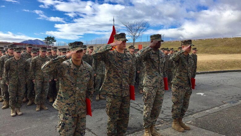 Four U.S. Marines receive Navy Achievement Medals during a battalion formation Jan. 9, 2017, aboard Combined Arms Training Center Camp Fuji, Japan, for their instinctive response when a vehicle with five passengers fell from the fifth story of a parking garage in Yokosuka, a city in the Greater Tokyo Area, Dec. 31, 2016. Once the Marines arrived on scene, the group flipped the car in order to remove the passengers prior to Japanese Emergency Medical Services arriving. The Marines are riflemen assigned to 3rd Battalion, 1st Marine Regiment and forward-deployed to 3rd Marine Division, III Marine Expeditionary Force, based in Okinawa, Japan. U.S. Marines pictured left to right: Lance Cpl. Manaure Arellano, Lance Cpl. James Flores, Lance Cpl. Raheem Gilliam and Pfc. Jacob Boerner.