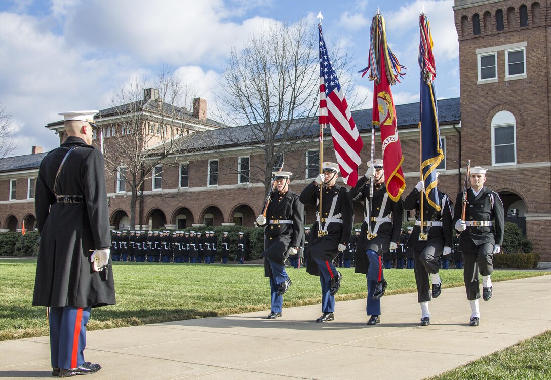 U.S. Marines and Sailors present colors during the Secretary of the Navy farewell parade at Marine Barracks Washington, Washington, D.C., Jan. 6, 2017. The parade was held in honor of the Honorable Raymond E. Mabus who was the longest serving Secretary of the Navy since World War I. 