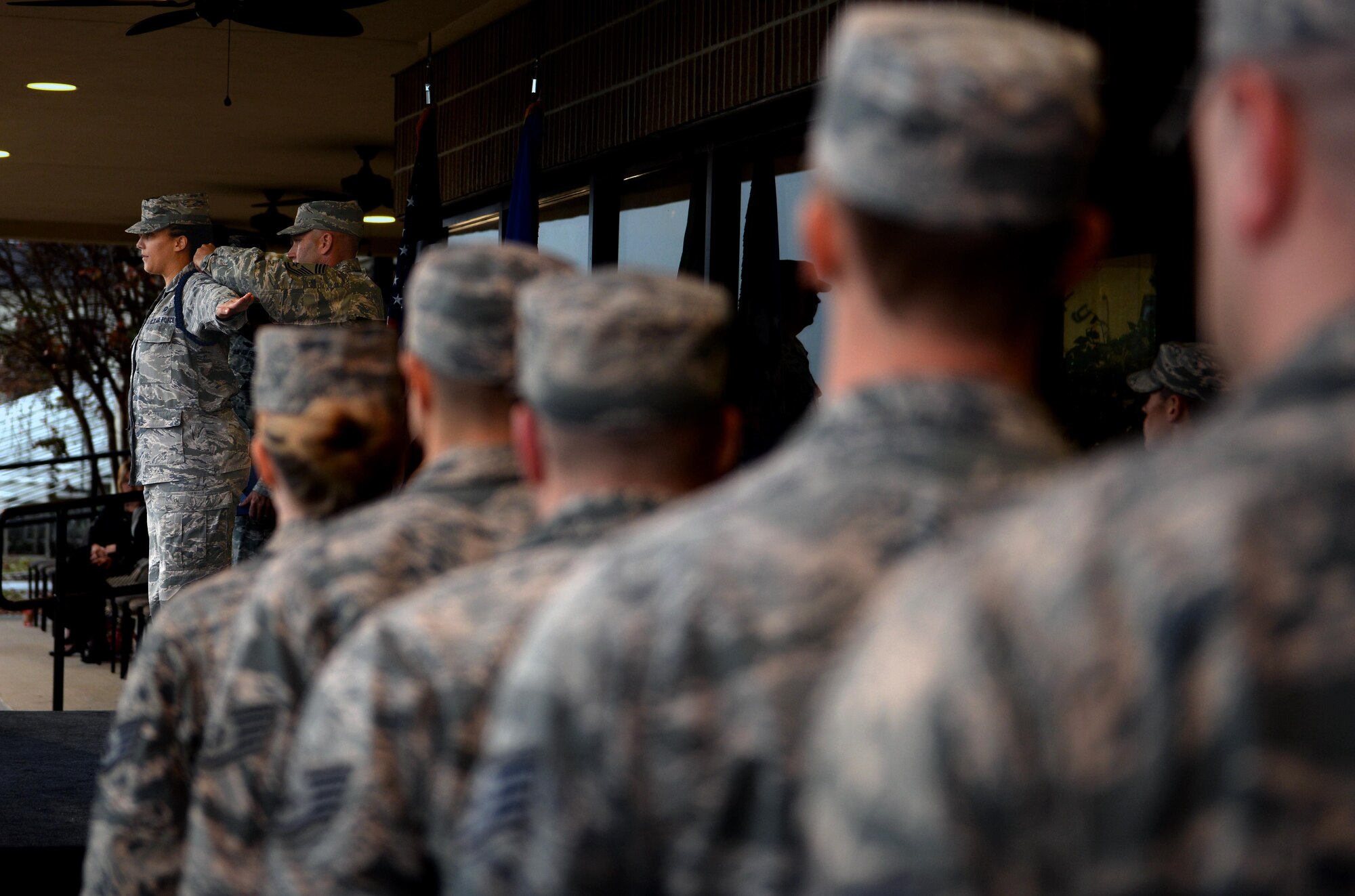 Staff Sgt. Latosha Enoch, 81st Training Support Squadron Military Training Leader Course student, receives her blue aiguillette from Chief Master Sgt. Anthony Fisher, 81st Training Group superintendent, during her class’s graduation ceremony, Dec. 22, 2016, on Keesler Air Force Base, Miss. The aiguillette, often referred to as a ‘blue rope,’ denotes an NCO as a military training leader who serves as a leader to non-prior service Airmen in training. (U.S. Air Force photo by Senior Airman Duncan McElroy)