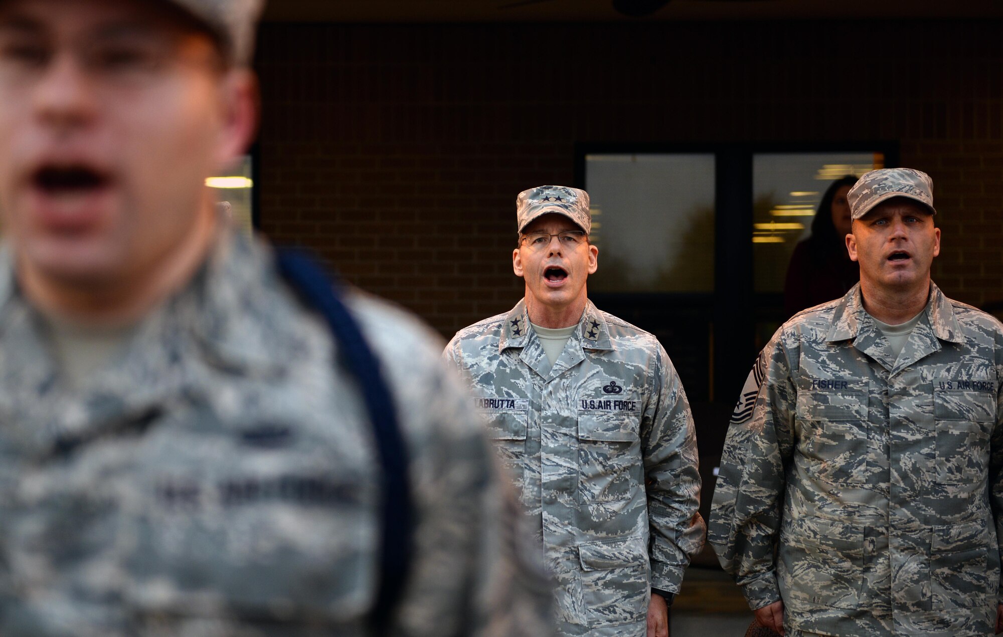Maj. Gen. Bob LaBrutta, 2nd Air Force commander, and Chief Master Sgt. Anthony Fisher, 81st Training Group superintendent, recite the Airman’s Creed during a Military Training Leader Course graduation ceremony at the Levitow Training Support Facility, Dec. 22, 2016, on Keesler Air Force Base, Miss. Twelve NCOs received their blue aiguillettes and will be assigned to different training groups within 2nd AF to mentor, train and lead non-prior service Airmen. (U.S. Air Force photo by Senior Airman Duncan McElroy)