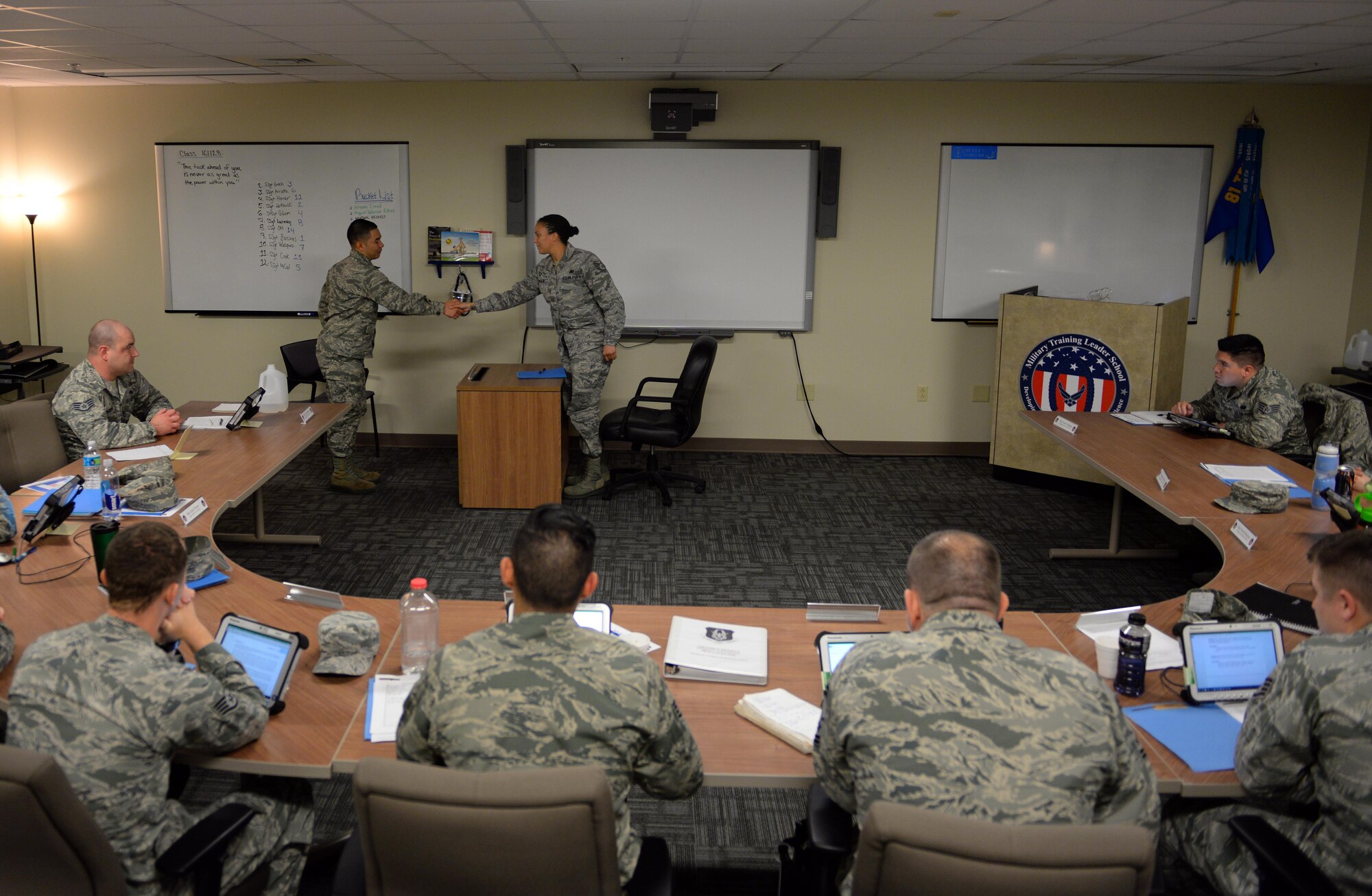 Staff Sgt. Latosha Enoch, 81st Training Support Squadron Military Training Leader Course student, shakes a non-prior service Airman’s hand following a counseling exercise Dec. 19, 2016, on Keesler Air Force Base, Miss. MTL Course instructors presented the students with different scripted issues Airmen may encounter in the training environment and evaluated on their ability to counsel Airmen based on each situation. (U.S. Air Force photo by Senior Airman Duncan McElroy)