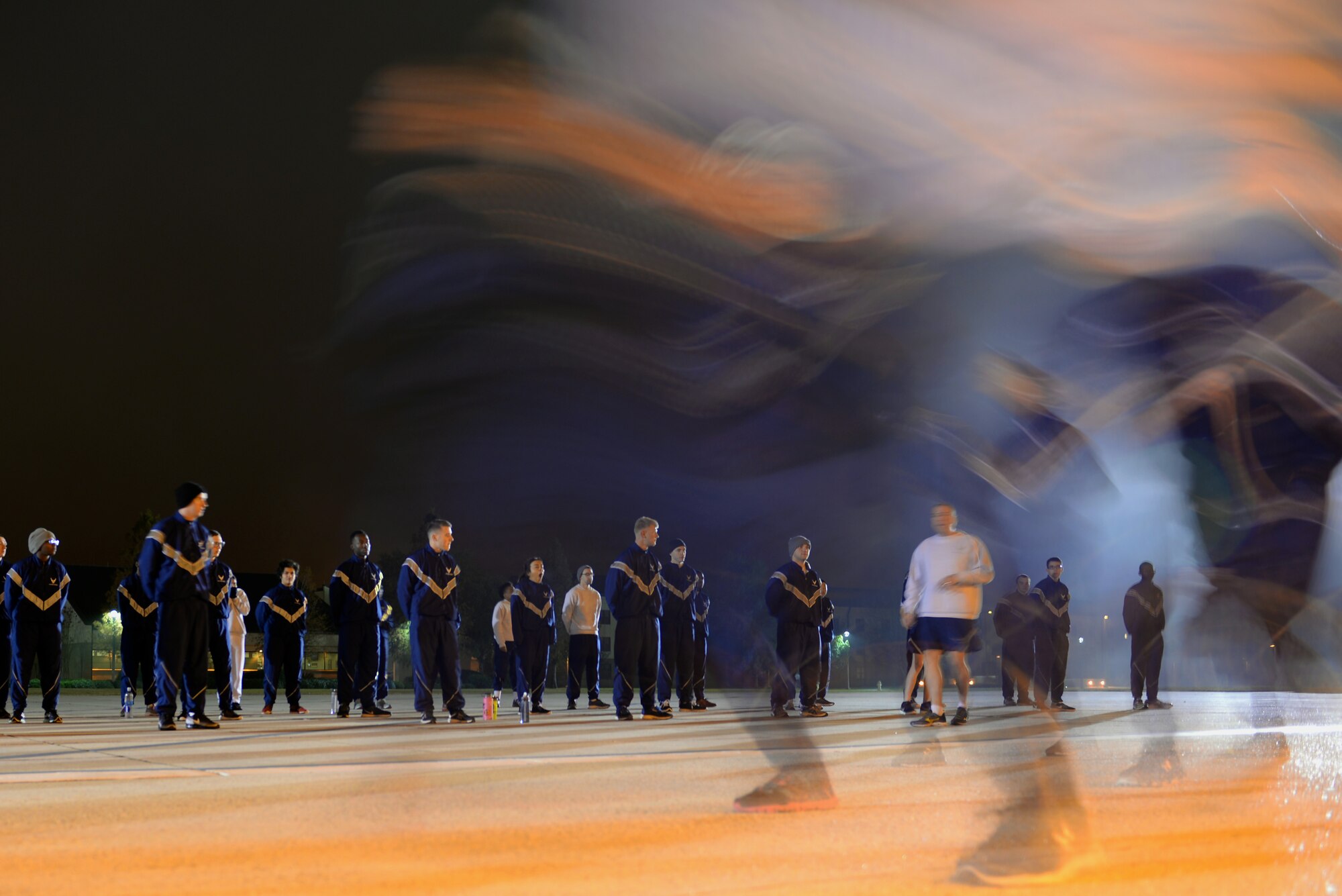 Master Sgt. Kyle Mullen, 81st Training Support Squadron Military Training Leader Course instructor, gives instructions to non-prior service Airmen and MTL Course students during a physical training evaluation at the Levitow Training Support Facility drill pad, Dec. 21, 2016, on Keesler Air Force Base, Miss. MTL Course instructors evaluated students on their ability to lead a PT session with NPS Airmen and tested them in a variety of different areas during the four-week course, including drill and ceremony, dress and appearance, mentorship, counseling and room inspections. (U.S. Air Force photo by Senior Airman Duncan McElroy)