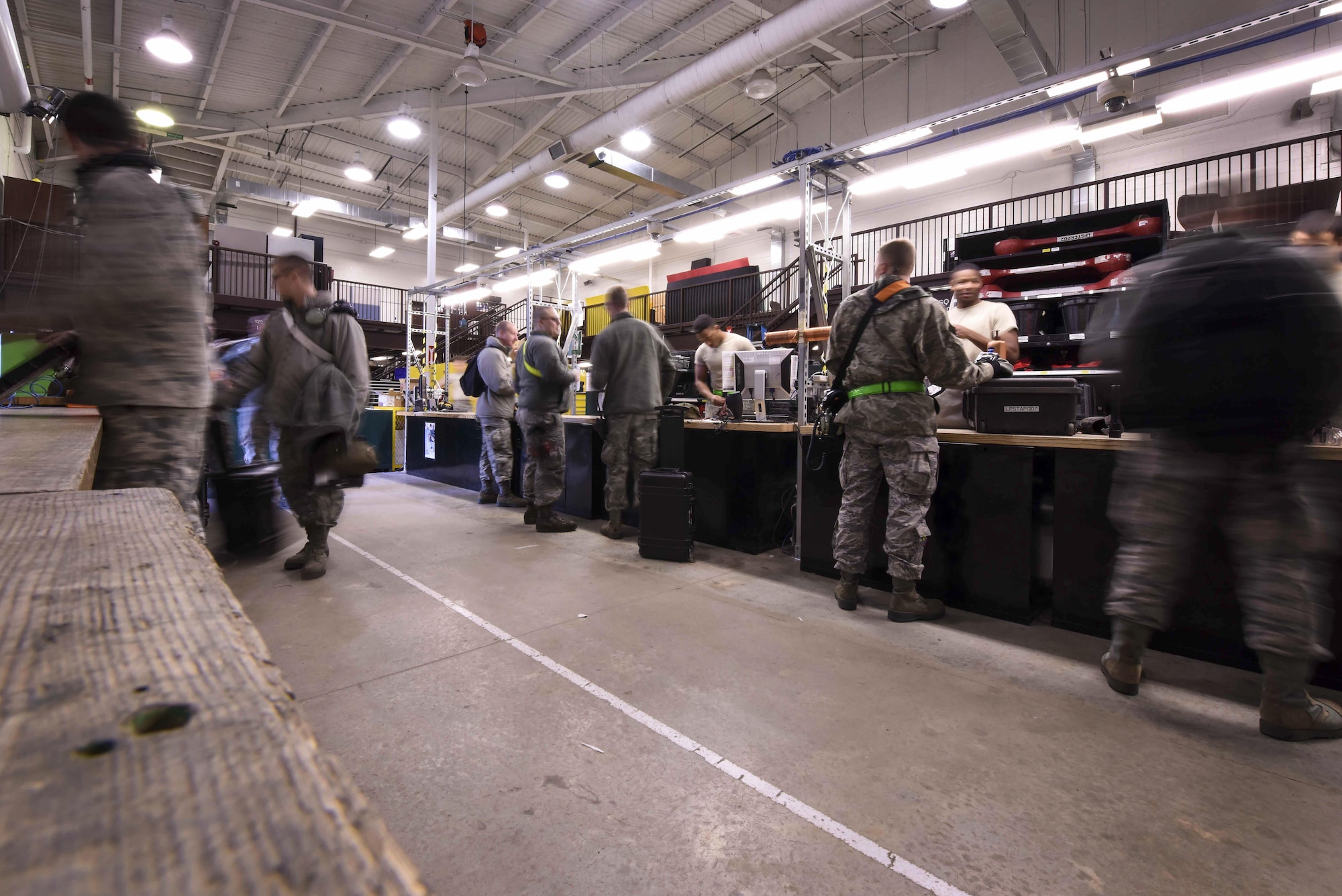 Members of the 19th Aircraft Maintenance Squadron turn in tools to the Composite Tool Kit shop at the end of a shift Jan. 4, 2017, at Little Rock Air Force Base, Ark. From cleaning tools to fixing them, every tool, bolt and screw must be checked out, inspected and rendered serviceable before it can be released for use. (U.S. Air Force photo by Senior Airman Stephanie Serrano)