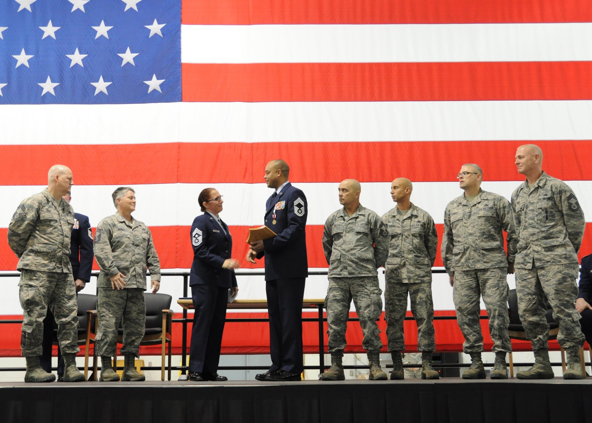 U.S. Air Force Chief Master Sgt. Kellie Askew, 442d Aircraft Maintenance Squadron deputy superintendent, joins the rank of chief during his promotion ceremony at Whiteman Air Force Base, Missouri, Jan. 7, 2017. Askew became an Air Reserve Technician for the 442d Maintenance Group in 1997. (U.S. Air Force photo/Senior Airman Missy Sterling)