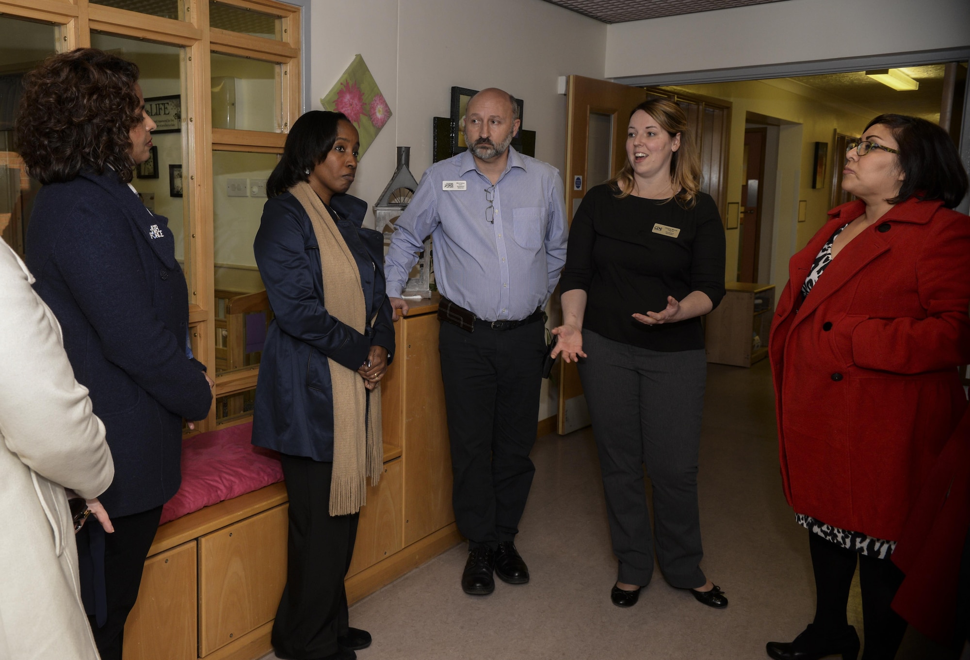 Amy Clark, left, spouse of U.S. Air Force Lt. Gen. Richard Clark, 3rd Air Force commander; and Yolanda Easton, second from left, spouse of U.S. Air Force Chief Master Sgt. Phillip Easton, 3rd Air Force command chief, visit the child development center during a tour Jan. 5, 2016, on RAF Mildenhall, England. The CDC provides quality childcare for children, ages 6 weeks to 5 years in an environment that celebrates each child’s individual successes through social, cognitive, affective, physical, language and creative development. (U.S. Air Force photo by Airman 1st Class Tenley Long)