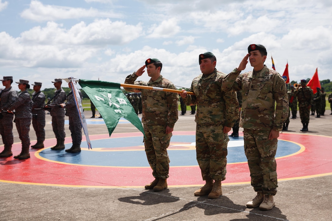 U.S. Army 7th Special Forces Group (Airborne) Soldiers present their unit’s guidon December 7, 2016 during an award ceremony in Florencia, Colombia. A Colombian Army Counter-narcotics Brigade, known as BRCNA, honored the U.S. Special Forces unit with the unit's “Bandera de Guerra” military medal. (U.S. Army photo by Staff Sgt. Osvaldo Equite)