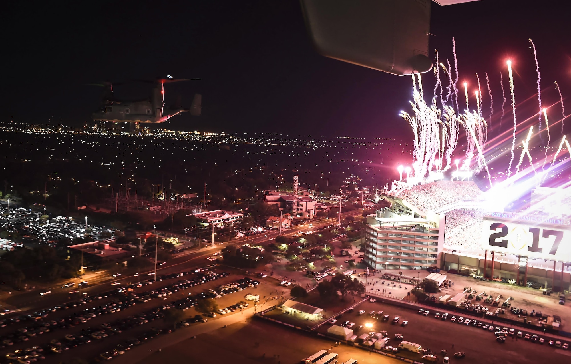 A CV-22 Osprey tiltrotor aircraft assigned to the 1st Special Operations Wing performs a flyover during the 2017 College Football Playoff National Championship game at Raymond James Stadium in Tampa, Fla., Jan. 9, 2017. The flyover was performed by two Ospreys and occurred during the playing of the National Anthem. (U.S. Air Force photo by Staff Sgt. Christopher Callaway)