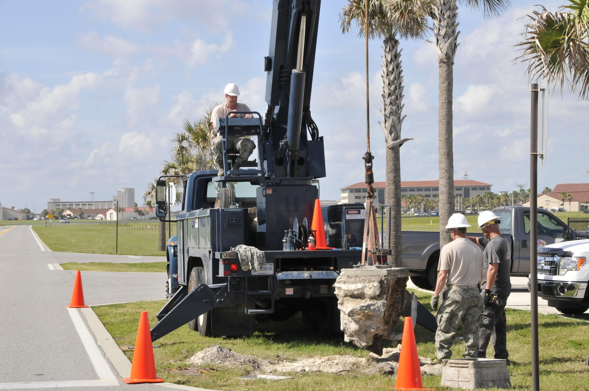 U.S. Air Force Airmen with the 181st Civil Engineering Squadron remove broken signal foundation at Patrick Air Force Base, July 12, 2016. The 181st and 45th civil engineers provided contingency related hands-on training for Air National Guard CE Airmen. (U.S. Air National Guard photo by Senior Master Sgt. John S. Chapman)