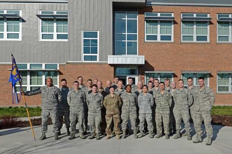 Members of the 1st Weather Squadron pose for a group photo Jan. 6, 2017 at Joint Base Lewis-McChord, Wash. The 1st WS won the Air Force Weather Squadron of the Year Award for 2016. The award recognizes a weather organization each year for excellent support to our Nation’s defense. (U.S. Air Force photo/Senior Airman Divine Cox)