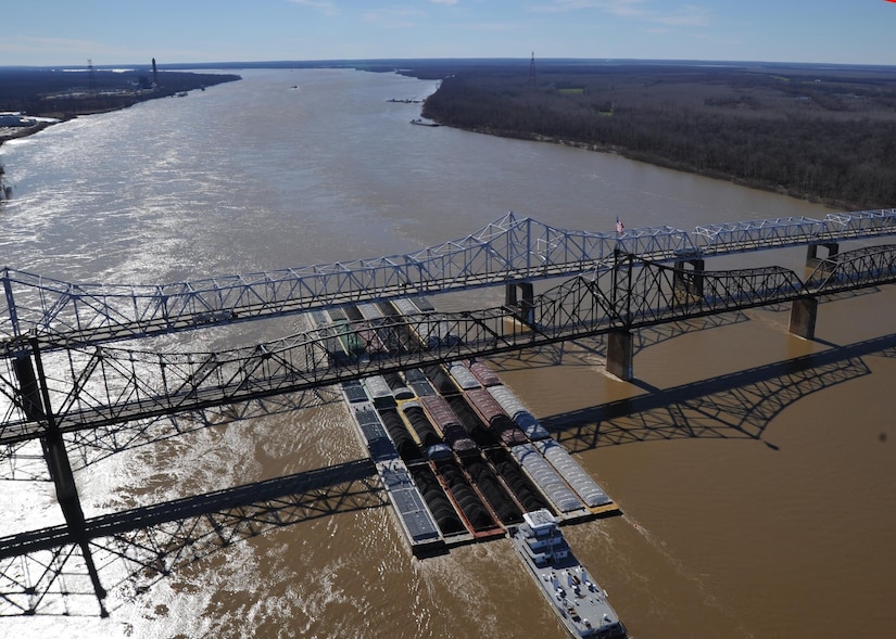 A tug pushing 35 barges passes under the Vicksburg, Miss., bridges on the Mississippi River, Jan. 31, 2013. About 15 percent of the total U.S. freight travels on the western rivers, a group that includes the Mississippi, Ohio and Missouri rivers and their tributaries. Coast Guard photo by Petty Officer 3rd Class Jonathan Lally