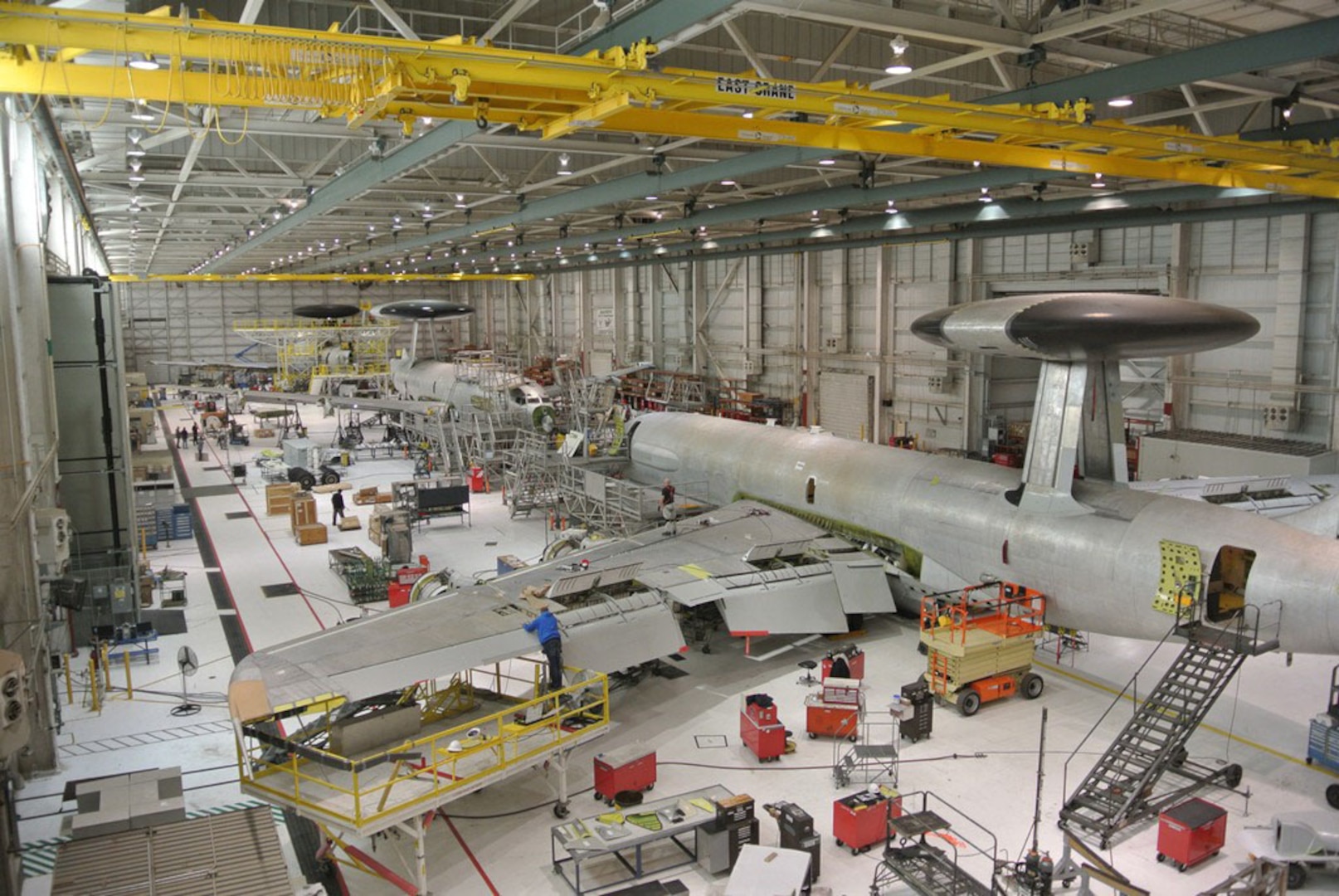 Workers at Tinker Air Force Base, Oklahoma, install critical 40/45 upgrades to E-3 AWACS aircraft during programmed depot maintenance at the Oklahoma City Air Logistics Complex. Defense Logistics Agency Energy recently awarded an energy saving performance contract to implement energy conservation measures at the OC-ALC.