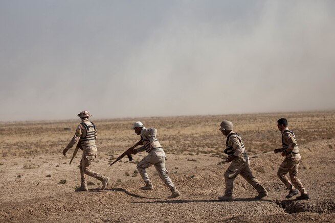 Iraqi security forces members advance to their next objective after breaching an obstacle during the combat engineer task training course at the Besmaya Range Complex, Iraq, Nov. 9, 2016. Camp Besmaya is one of four Combined Joint Task Force – Operation Inherent Resolve (CJTF-OIR)building partner capacity locations dedicated to training Iraqi security forces. Combined Joint Task Force-Operation Inherent Resolve is a multinational effort to weaken and destroy Islamic State in Iraq and the Levant operations in the Middle East region and around the world.(U.S. Army photo by Sgt. Josephine Carlson)