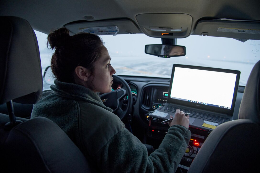Airman 1st Class Laura Dolch, 436th Operations Support Squadron airfield management operations coordinator, conducts a runway condition reading during a snow storm Jan. 7, 2017, at Dover Air Force Base, Del. The reading helps determine if the runway is suitable for aircraft to take off or land. (U.S. Air Force photo by Mauricio Campino)