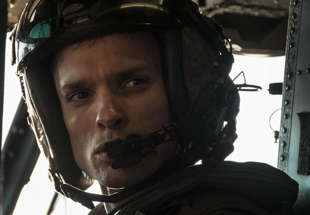 A Marine from Marine Heavy Helicopter Squadron 772 speaks through his headset during a training exercise over the ranges at Joint Base McGuire-Dix-Lakehurst, N.J., Mar. 30, 2016. HMH-772 falls under the Marine Aircraft Group 49, a reservist detachment at the Joint Base MDL. (U.S. Air Force photo/Senior Airman Lauren Pitts)