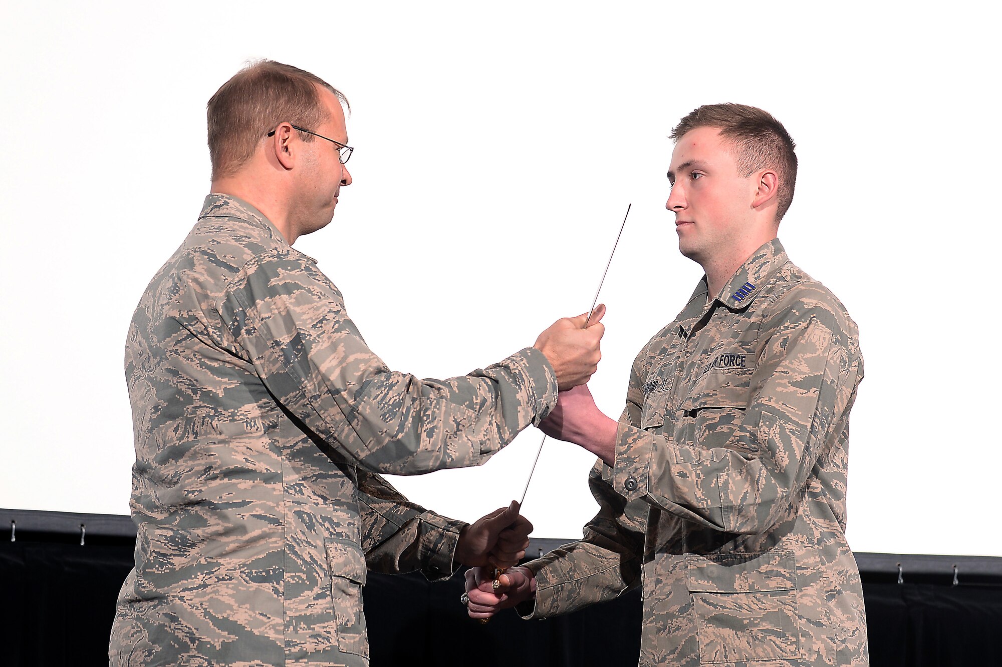 Cadet 1st Class Jacob Yarwood (right) is given command of the Cadet Wing by Brig. Gen. Stephen Williams, the commandant of cadets, Jan. 4, 2016, at the U.S. Air Force Academy. (U.S. Air Force photo/Darcie Ibidapo)