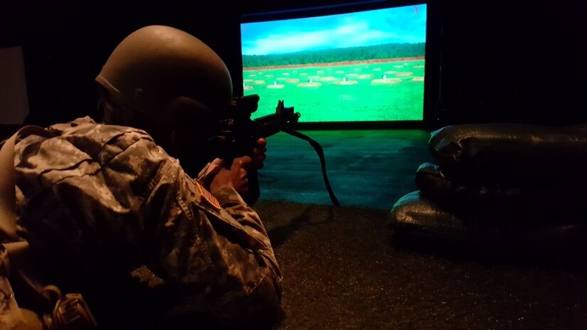 U.S. Army Reserve Pfc. Mark McGhee, from Headquarters and Headquarters Company, 647th Regional Support Group, engages targets with an air-powered and digital-enhanced M4 carbine rifle using the Engagement Skills Trainer 2000 during the 647th RSG’s Best Warrior Competition on Fort Bliss, Texas, Jan. 6-8, 2017.  (U.S. Army Reserve photo by Sgt. 1st Class Carlos Rouse)