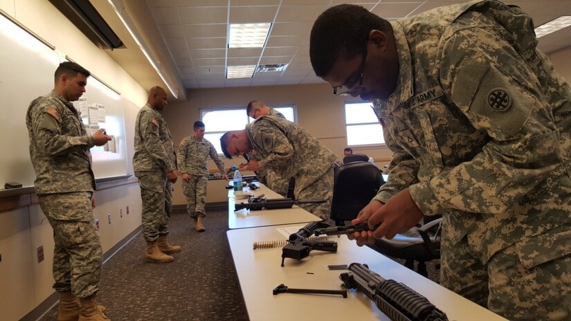 U.S. Army Reserve Soldiers from 647th Regional Support Group, 4th Sustainment Command (Expeditionary), disassemble and re-assemble M4 carbine rifles in record time to earn points for the 647th RSG Best Warrior Competition on Fort Bliss, Texas, Jan. 6-8, 2017.  (U.S. Army Reserve photo by Sgt. 1st Class Carlos Rouse)