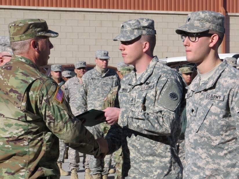 U.S. Army Reserve Col. Craig Cox, commander of 647th Regional Support Group, 4th Sustainment Command (Expeditionary), presents awards to Soldiers who competed in the 647th RSG’s Best Warrior Competition on Fort Bliss, Texas, Jan. 6-8, 2017.  (U.S. Army Reserve photo by Sgt. Guzman Garza)