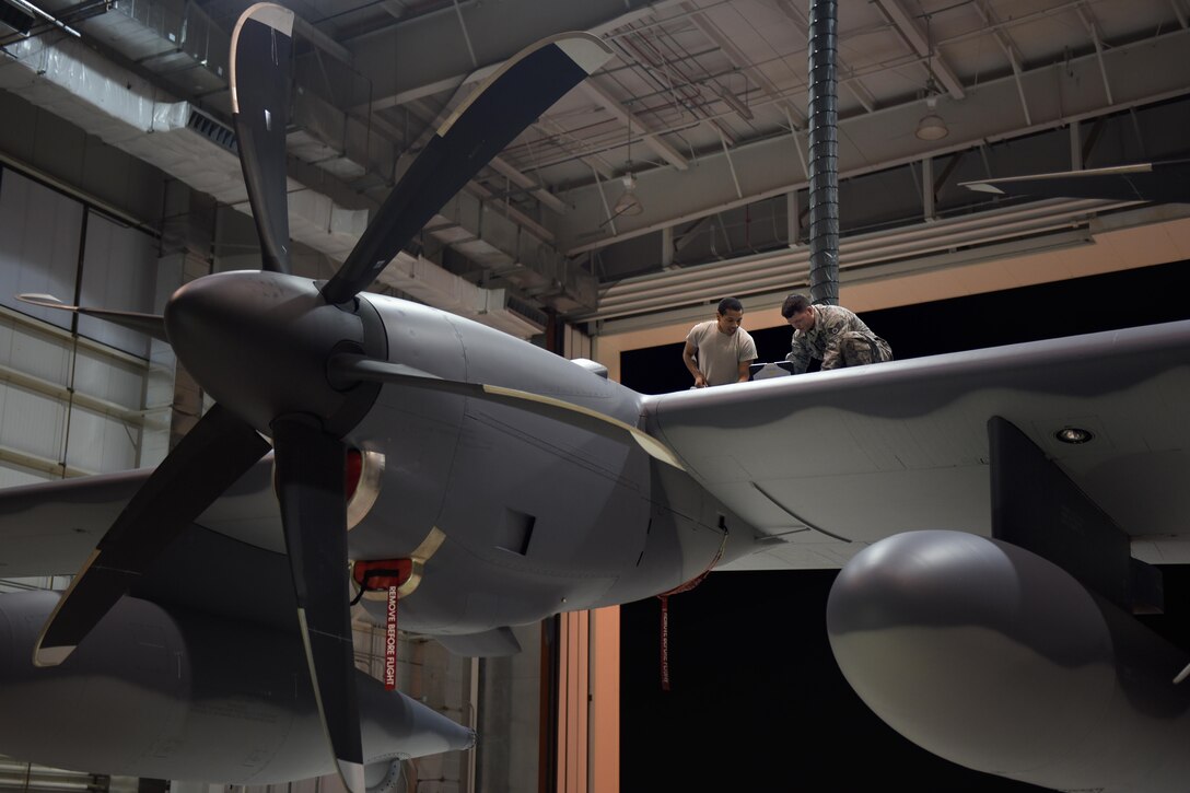 Fuels technicians with the 27th Special Operations Maintenance Squadron run through an inspection checklist on an MC-130J, November 16, 2016, at Cannon Air Force Base, N.M. Fuels technicians are part of a large group of Cannon Air Commandos who work through the night to keep aircraft flying. (U.S. Air Force Photo by Senior Airman Shelby Kay-Fantozzi/released) 
