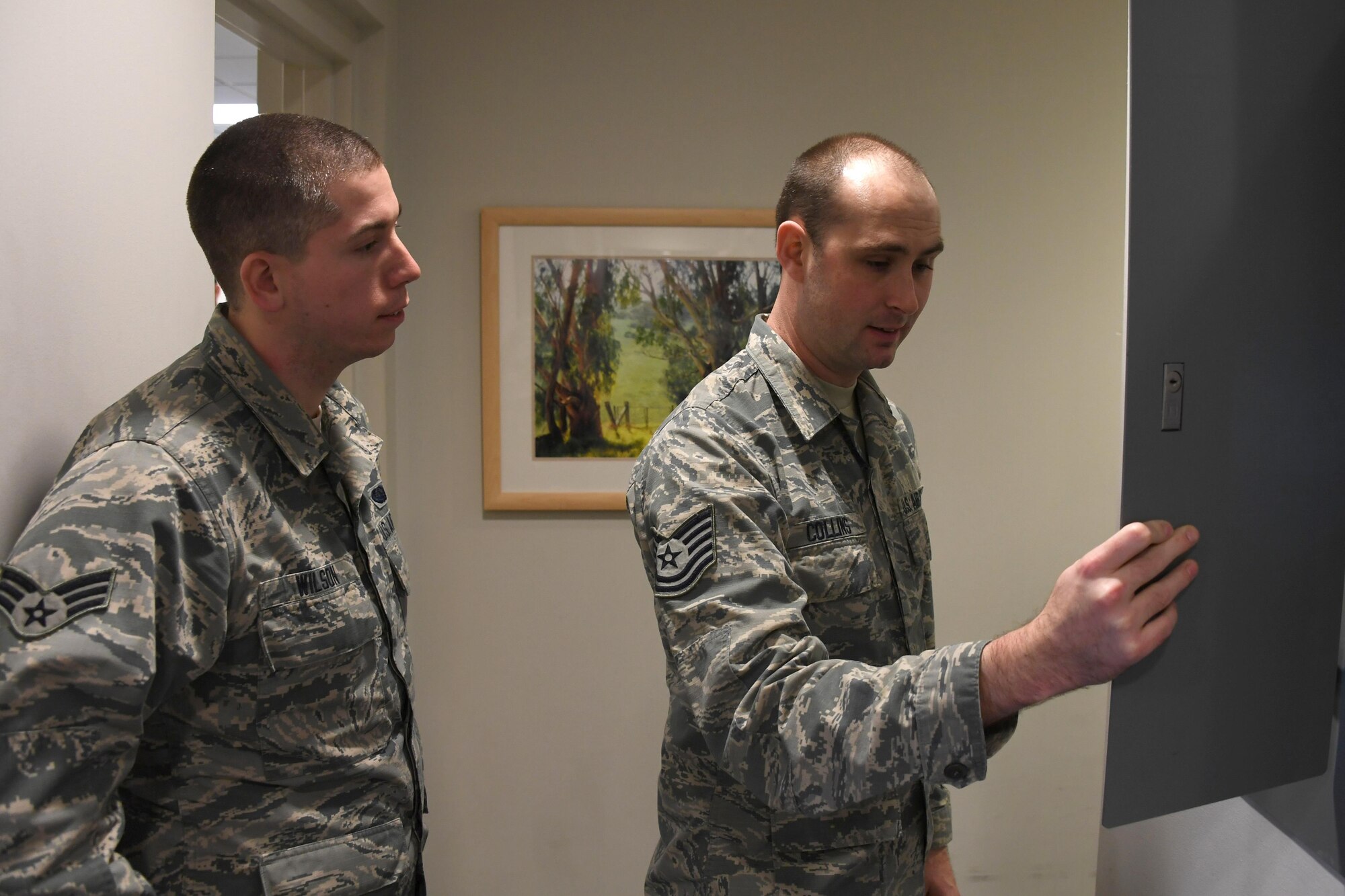 Tech. Sgt. Steven Collins, occupational safety technician with the 911th Airlift Wing, and Senior Airman Andrew Wilson, client systems technician with the 911th Communications Squadron, inspect a circuit breaker in the 911th CS building at the Pittsburgh International Airport Air Reserve Station, Jan. 7, 2017. As a safety technician, Collins conducts periodic safety inspections to mitigate mishaps before they occur. (U.S. Air Force photo by Staff Sgt. Marjorie A. Bowlden)