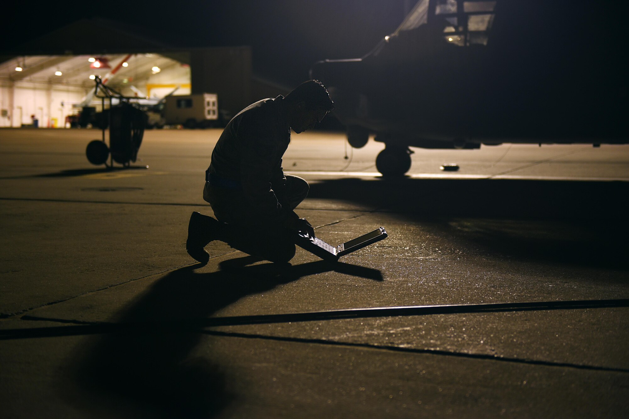An Air Commando with the 27th Special Operations Maintenance Squadron’s Aircraft Structural Maintenance shop consults a technical order November 16, 2016 at Cannon Air Force Base, N.M. Aircraft structural maintainers are part of a large group of Cannon Air Commandos who work through the night to keep aircraft flying. (U.S. Air Force Photo by Senior Airman Shelby Kay-Fantozzi/released) 